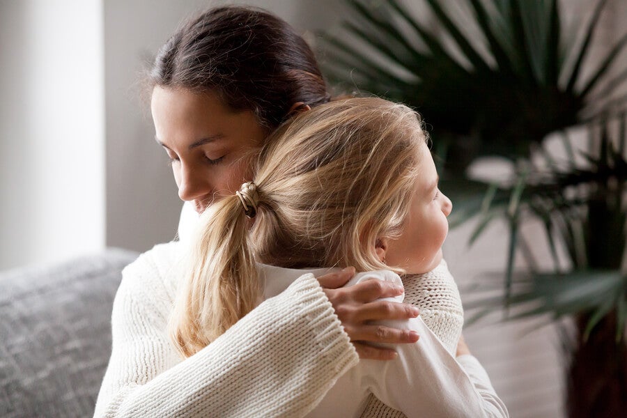 A hug between mother and daughter.