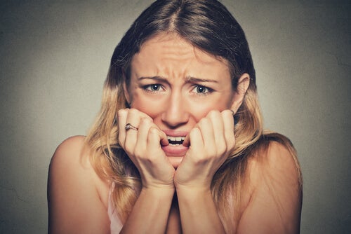 Woman biting her nails