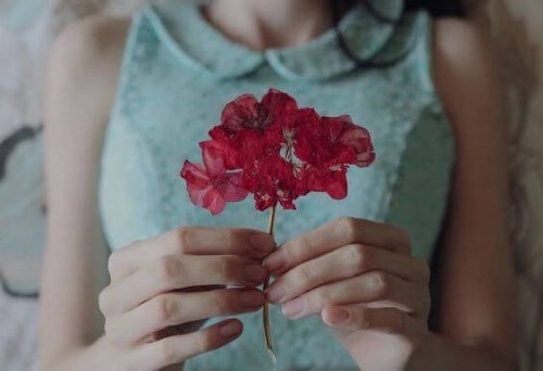 Woman with a pink flower