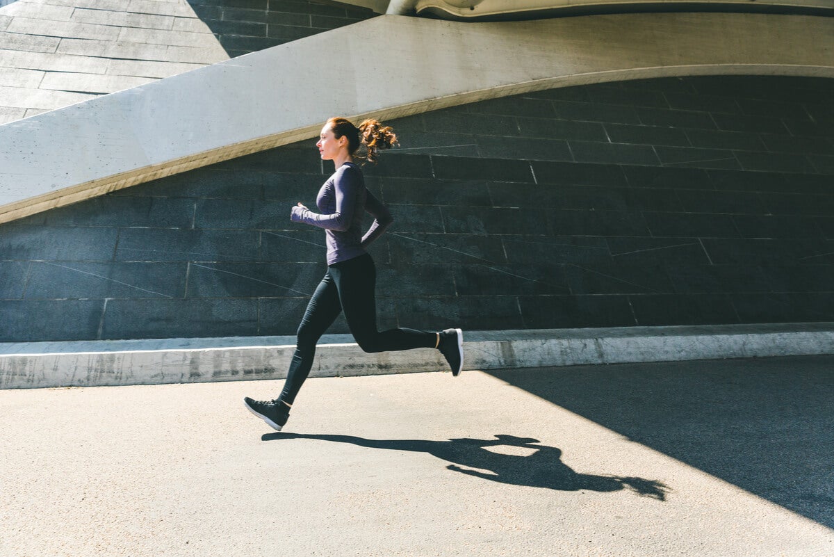 Woman jogs in the city.