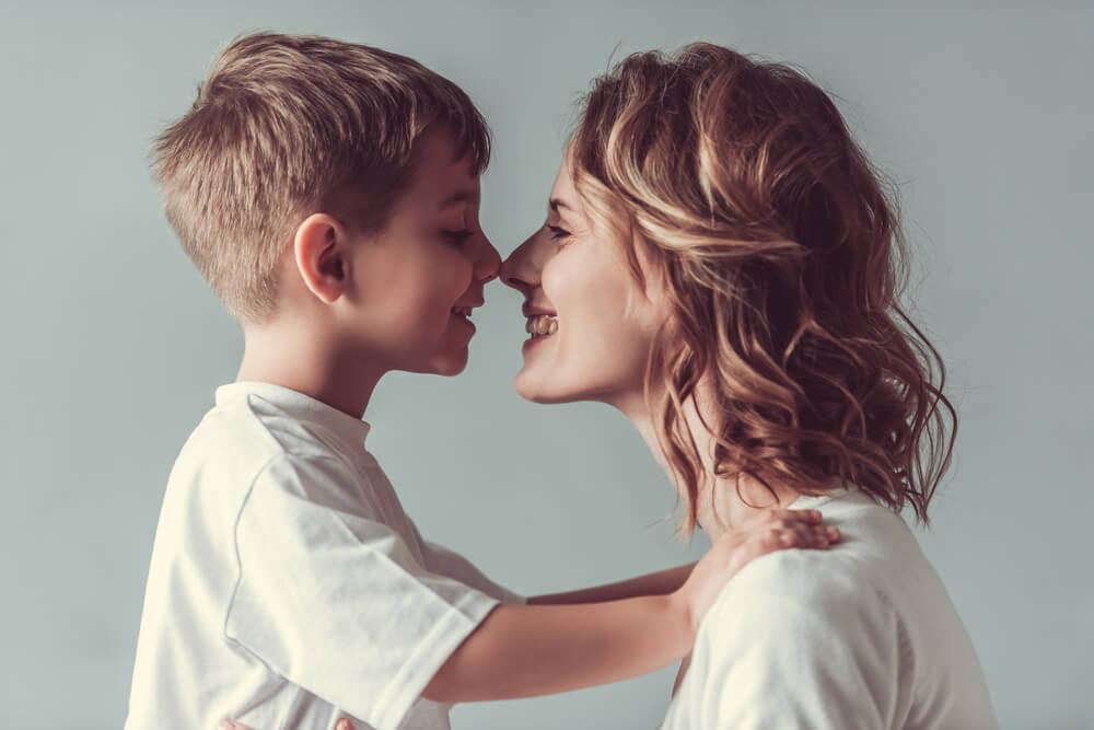 Mother and son having a happy farewell.