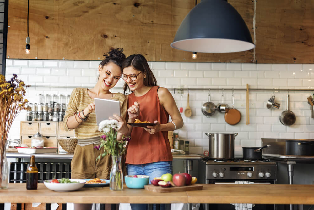 People cooking in a smiling attitude.