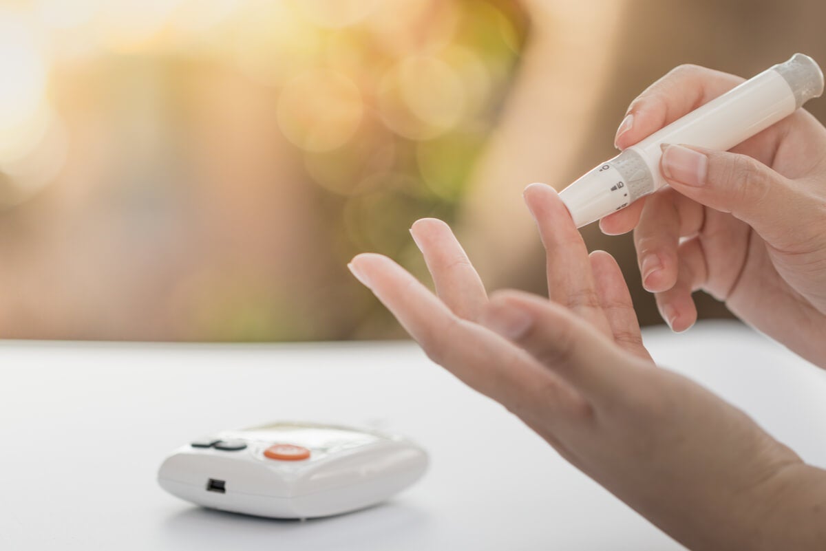 Patient measuring blood glucose