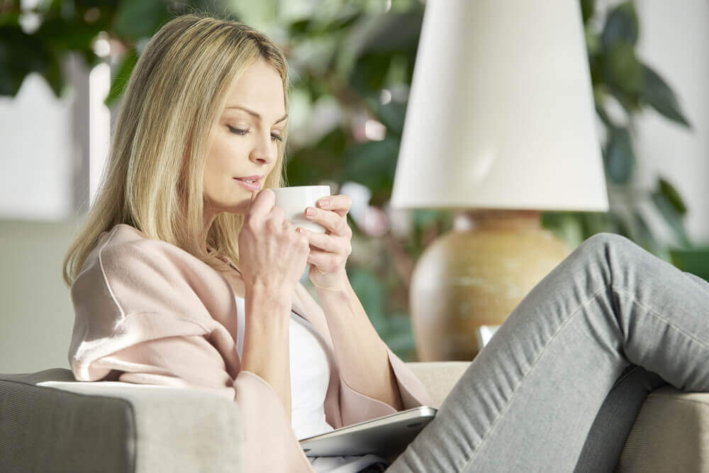 Woman drinking senna tea 