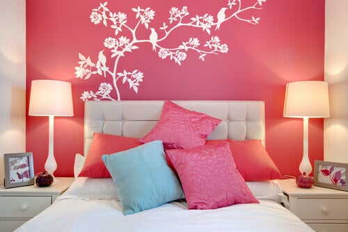 Pink bed with white duvet cover.