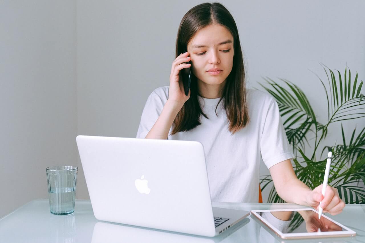 Woman teleworking with technology.