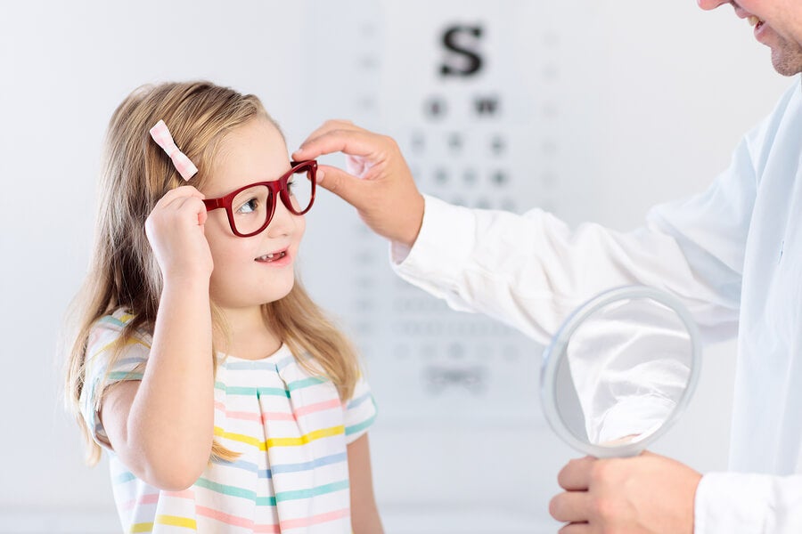 Little girl with glasses at the ophthalmologist