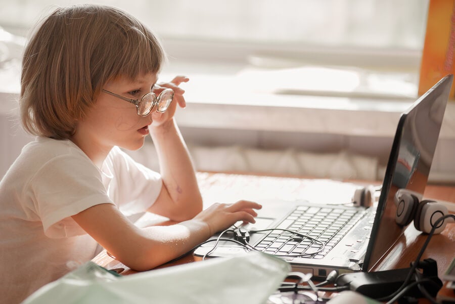 Girl with glasses using computer