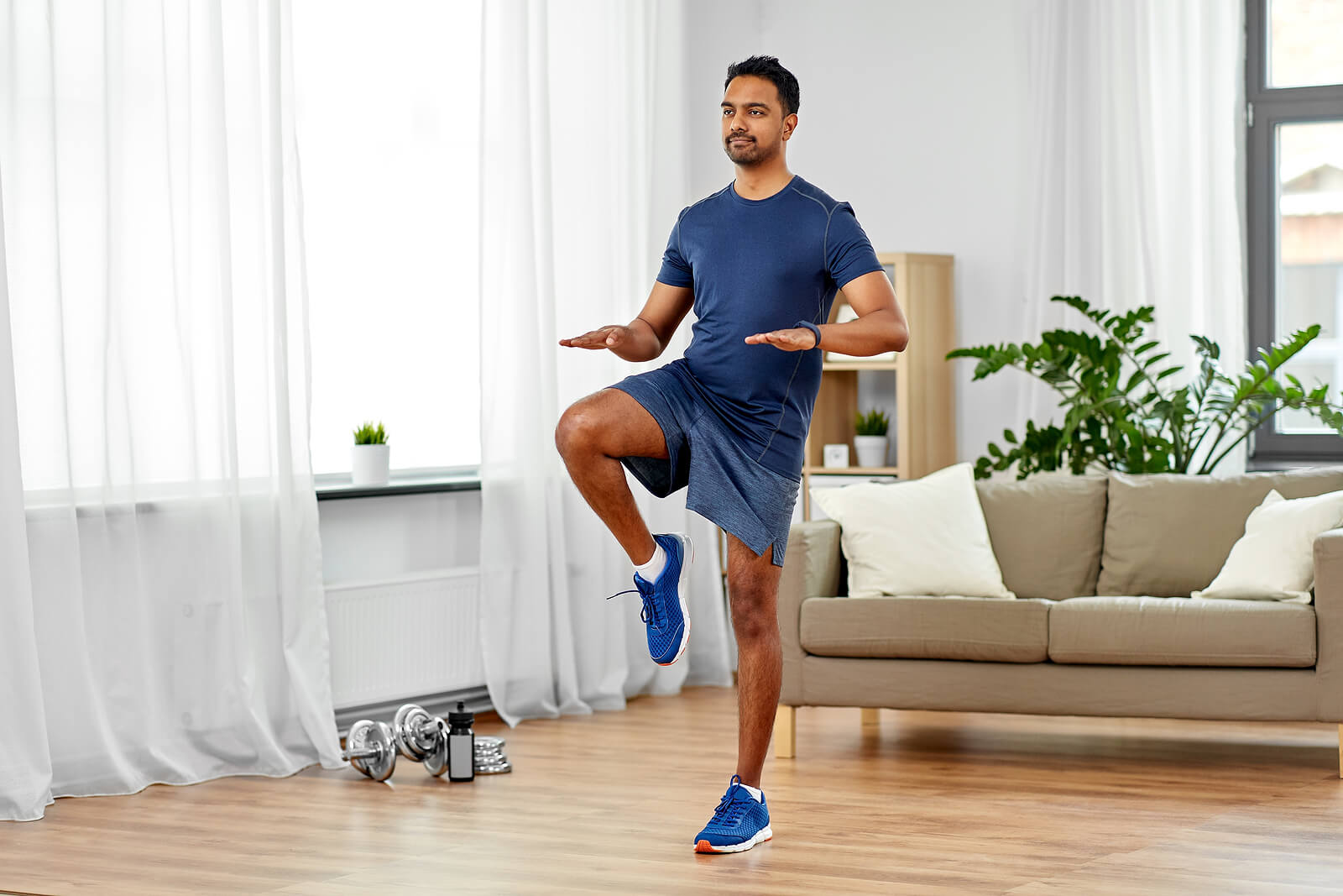 Man exercising at home.